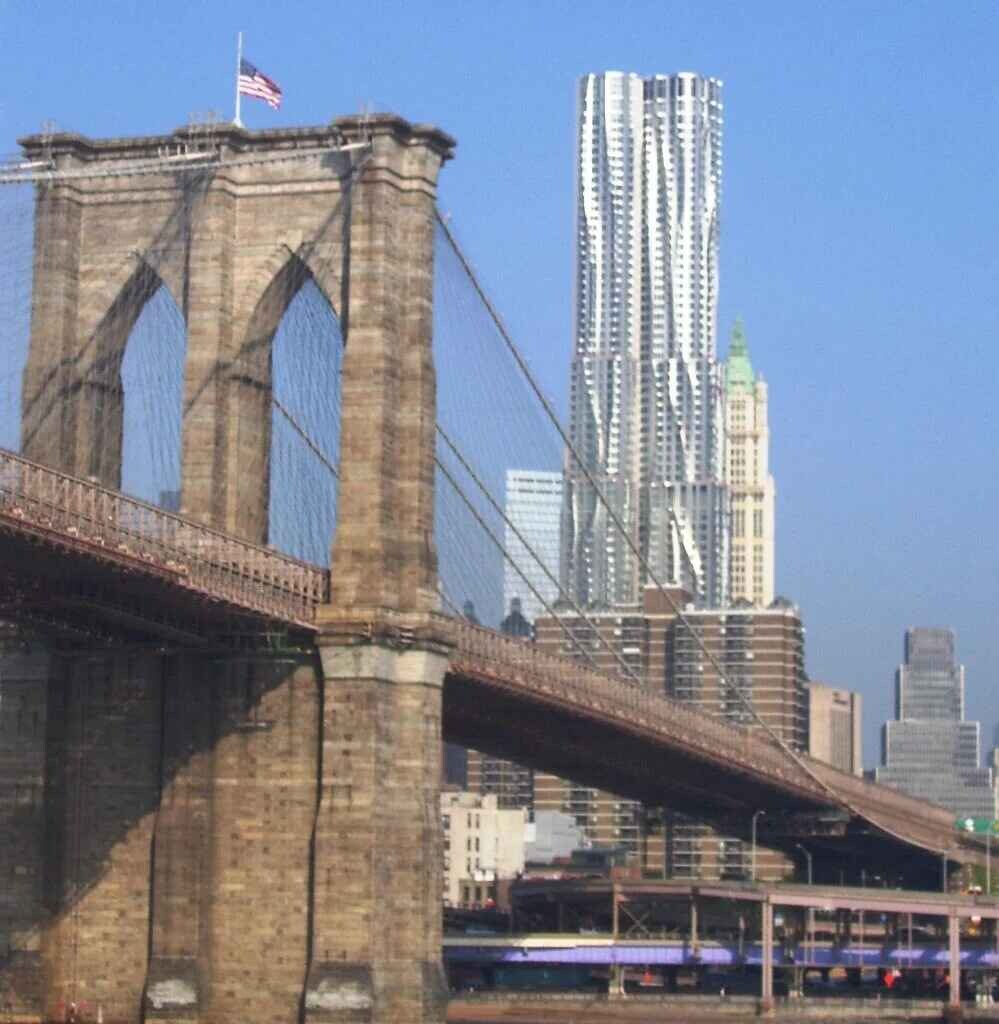 The Brooklyn Bridge with 8 Spruce Street, designed by Frank Gehry, in the background.